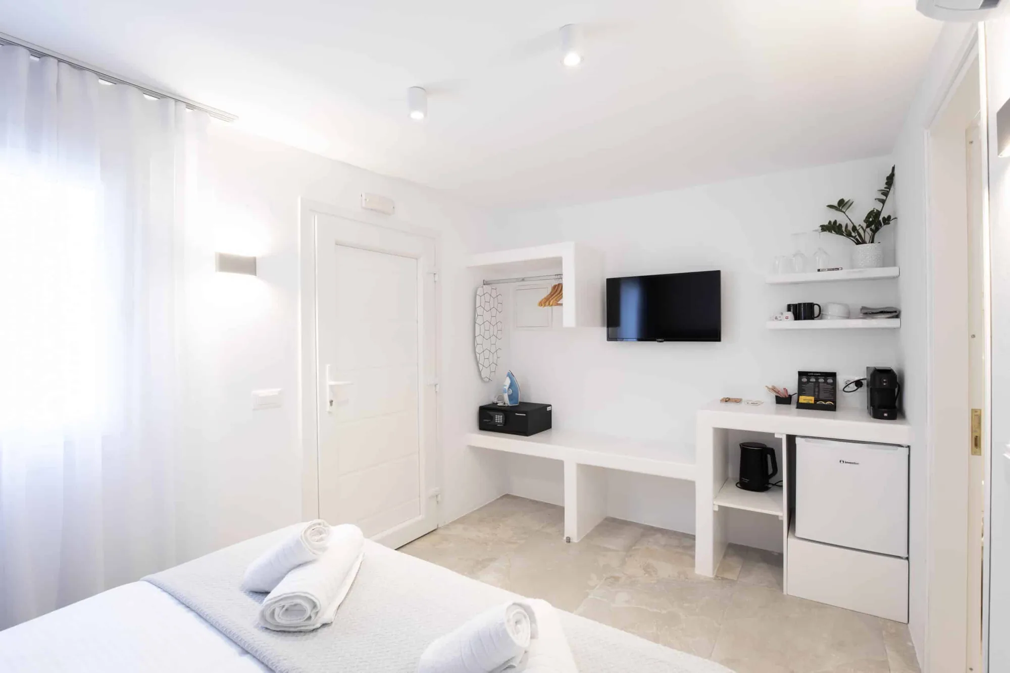 TV wall with shelves and coffee station
